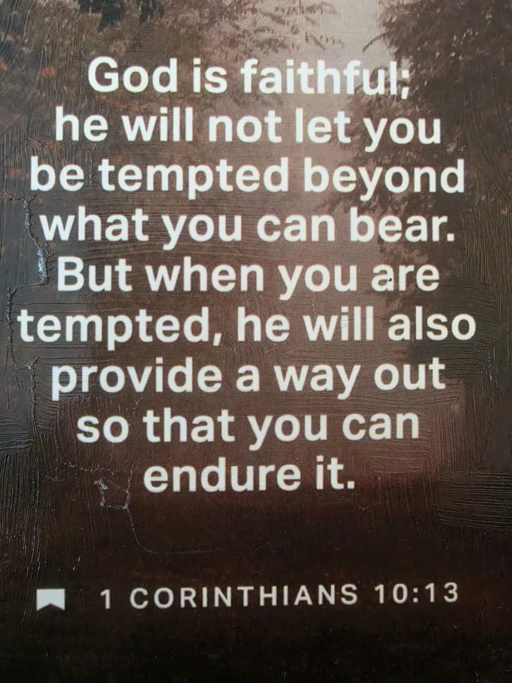 Framed print in the image features the biblical passage 1 Corinthians 10:13